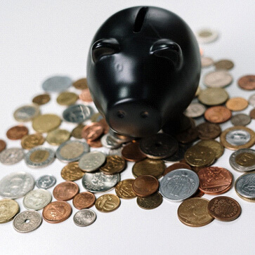black piggy bank on coins