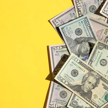 cash on yellow background