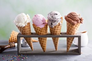 Four ice cream cones set on a display stand