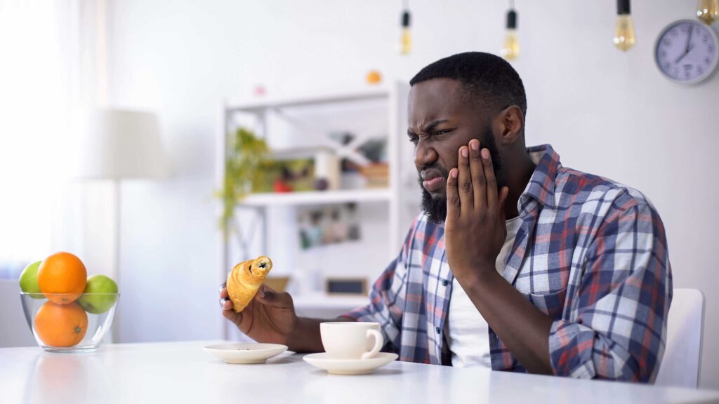 Man with a sensitive tooth